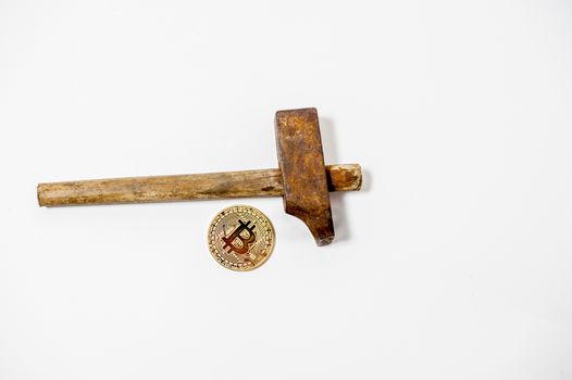 bitcoin electronic coin with iron hammer
