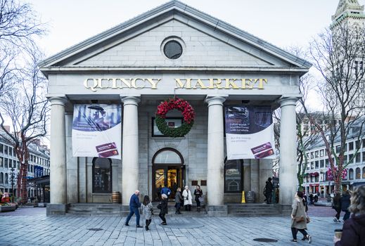 BOSTON, USA - NOVEMBER 26: Initially built as an indoor commercial pavilion, The Quincy Market was naturally expanded to a plaza surrounded by stores as seen on November 26, 2017 in Boston, MA, USA.