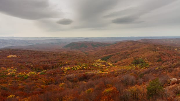 Panorama. Sunset sky above the autumn mountains.