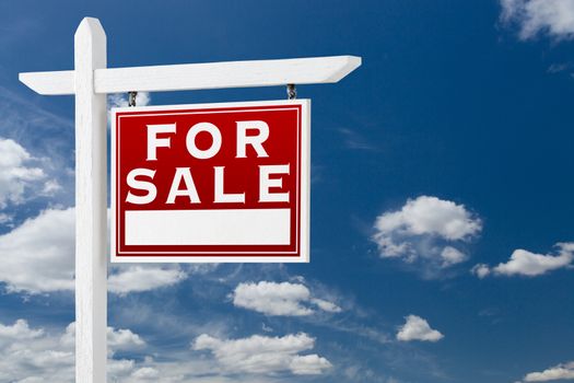 Right Facing For Sale Real Estate Sign Over Blue Sky and Clouds With Room For Your Text.