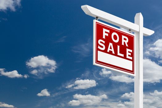 Left Facing For Sale Real Estate Sign Over Blue Sky and Clouds With Room For Your Text.