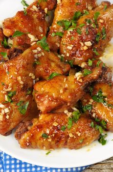Fried chicken wings in ginger garlic marinade with herbs