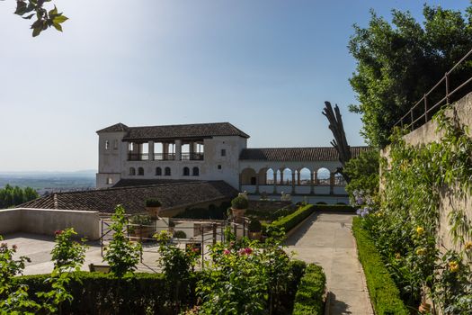 Beautiful view of the Generalife fountain and gardens in Alhambra. GRANADA, SPAIN on a bright sunny day