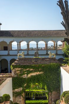 Beautiful view of the Generalife fountain and gardens in Alhambra. GRANADA, SPAIN on a bright sunny day