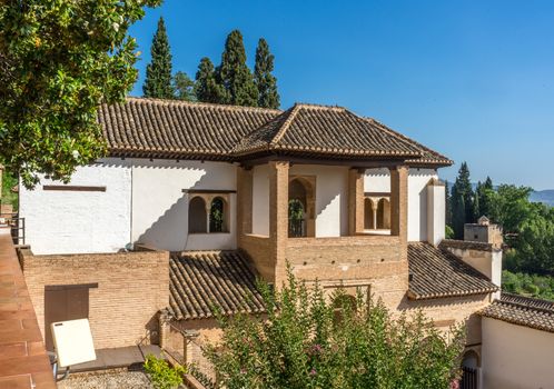 Beautiful view of the Generalife fountain and gardens in Alhambra. GRANADA, SPAIN on a bright sunny day