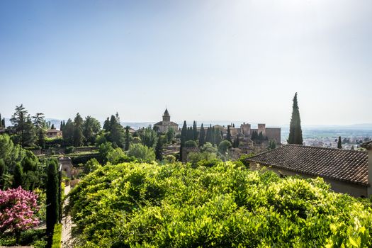 View of the bell tower of the Alhambra  from the Generalife gardens in Granada, Spain, Europe on a bright summer day