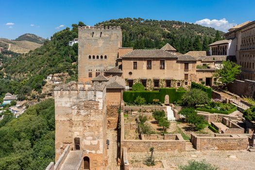 View of the Nasrid Palaces (Palacios Nazaries)  in Alhambra, Granada on a beautiful summer day, Spain, Europe, clear blue sky