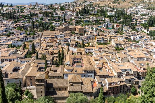 Aerial view of the city of Granada, Albaycin , viewed from the Alhambra palace in Granada, Spain, Europe on a bright summer day with blue sky