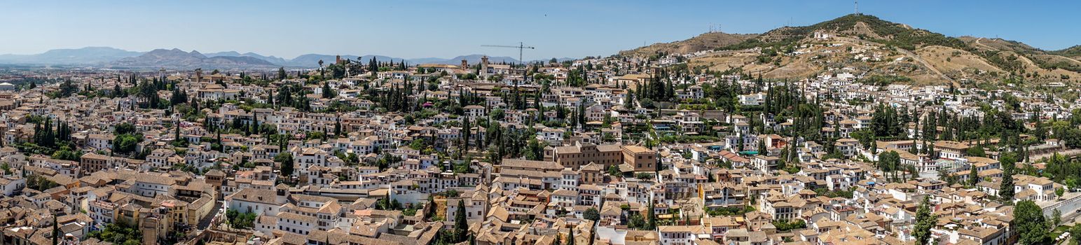 Panorama Aerial view of the city of Granada, Albaycin , viewed from the Alhambra palace in Granada, Spain, Europe on a bright summer day with blue sky