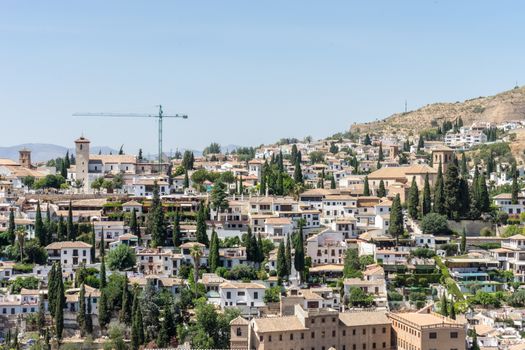 Aerial view of the city of Granada, Albaycin , viewed from the Alhambra palace in Granada, Spain, Europe on a bright summer day with blue sky