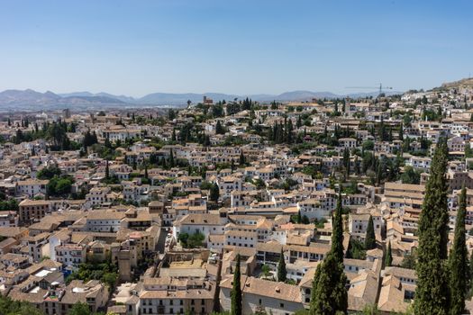 Aerial view of the city of Granada, Albaycin , viewed from the Alhambra palace in Granada, Spain, Europe on a bright summer day with blue sky