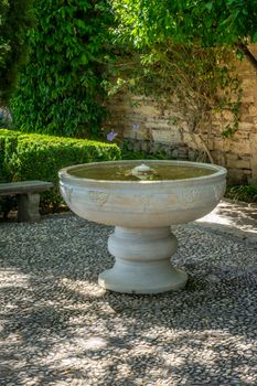 Cool Water fountain in the Alhambra in Granada, Spain, Europe on a bright sunny day