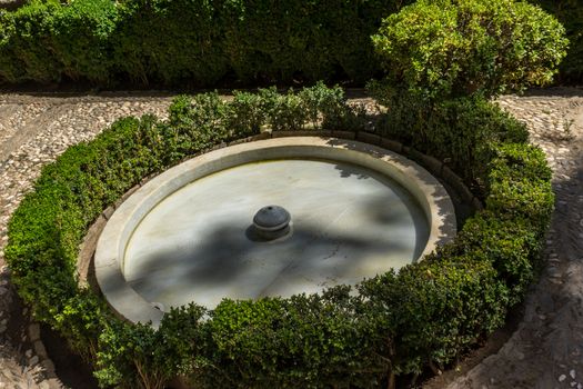 Cool Water fountain in the Alhambra in Granada, Spain, Europe on a bright sunny day