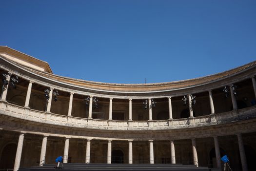 The Colosseum, columns and atrium of Alhambra palace, Granada, Spain, Europe on a bright sunny summer day with clear blue sky