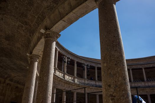 The Colosseum, columns and atrium of Alhambra palace, Granada, Spain, Europe on a bright sunny summer day with clear blue sky