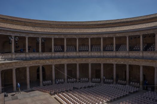 The Colosseum, columns and atrium of Alhambra palace, Granada, Spain, Europe on a bright sunny summer day with clear blue sky