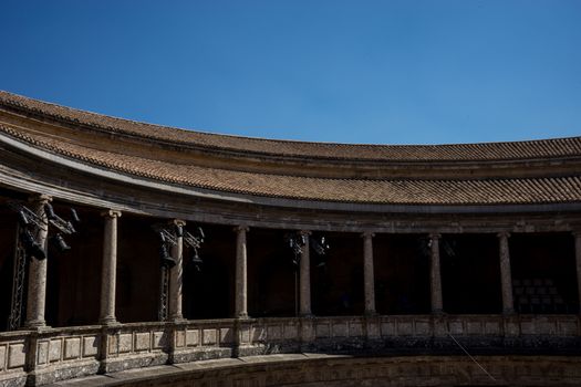 The Colosseum, columns and atrium of Alhambra palace, Granada, Spain, Europe on a bright sunny summer day with clear blue sky