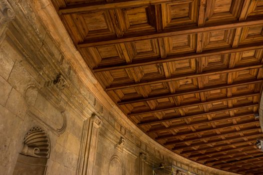 The curver ceiling at the Colosseum, columns and atrium of Alhambra palace, Granada, Spain, Europe on a bright sunny summer day with clear blue sky