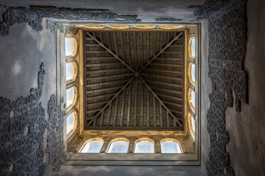 Pointed rooftop interior with windows in Granada, Spain, Europe on a bright sunny day