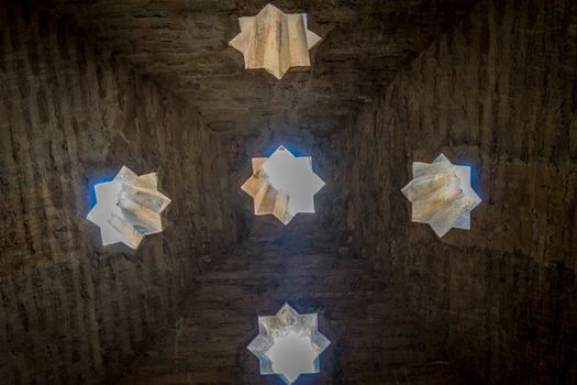 Pointed rooftop interior with star windows in Granada, Spain, Europe on a bright sunny day