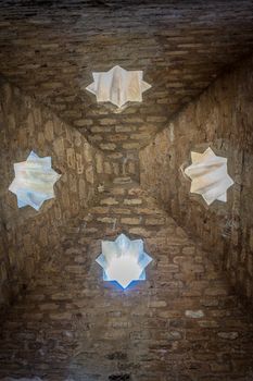 Pointed rooftop interior with star windows in Granada, Spain, Europe on a bright sunny day