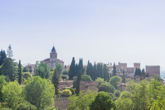 View of the bell tower of the Alhambra  from the Generalife gardens in Granada, Spain, Europe on a bright summer day