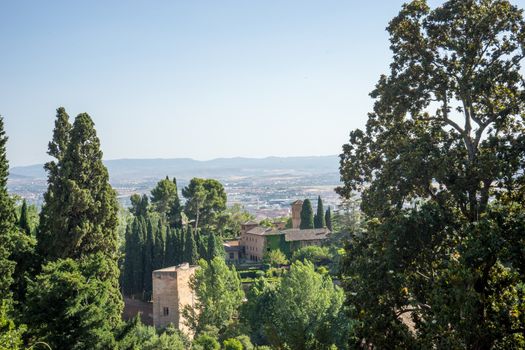 View of the bell tower of the Alhambra  from the Generalife gardens in Granada, Spain, Europe on a bright summer day