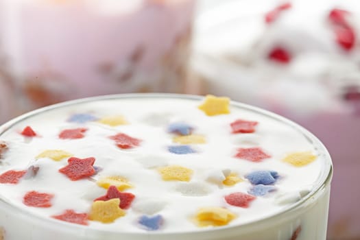 Natural homemade yogurt decorated with multicolored stars