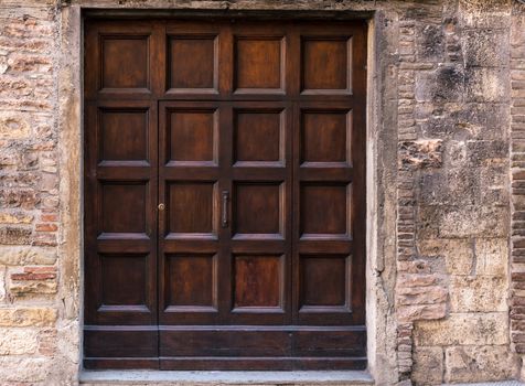 Gubbio (Italy): Old door on medieval stone wall