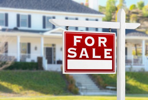 Left Facing For Sale Real Estate Sign In Front of House.