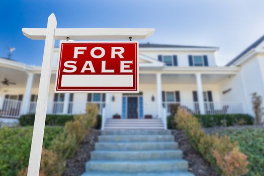 Right Facing For Sale Real Estate Sign In Front of House.