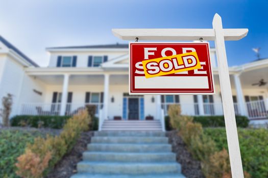 Left Facing Sold For Sale Real Estate Sign In Front of House.