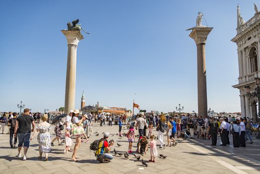 VENICE - JULY 1: San Marco square and the columns of San Marco and San Todaro on July 1, 2017 in Venice, Italy