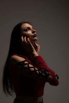 gothic style girl in red shirt, looking up