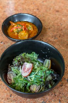 Fresh salad with red curry shrimp