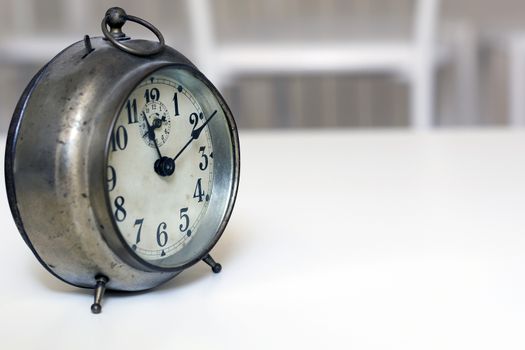 old clock on a white background. Interior shot. Nobody