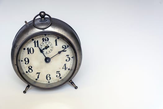 old clock on a white background. Interior shot. Nobody
