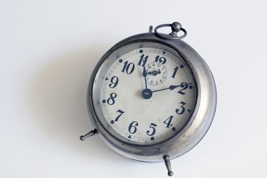 old clock on a white background. Interior shot. Nobody