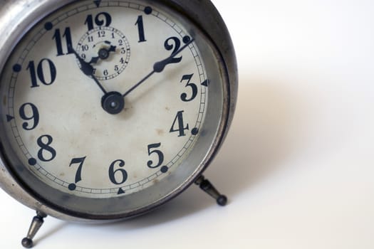 old clock on a white background. Interior shot. Nobody
