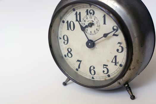 old clock on a white background. Interior shot. Nobody