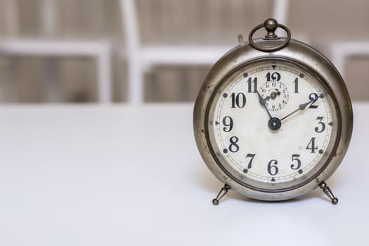 old clock on a white background. Interior shot. Nobody