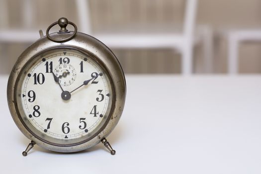 old clock on a white background. Interior shot. Nobody