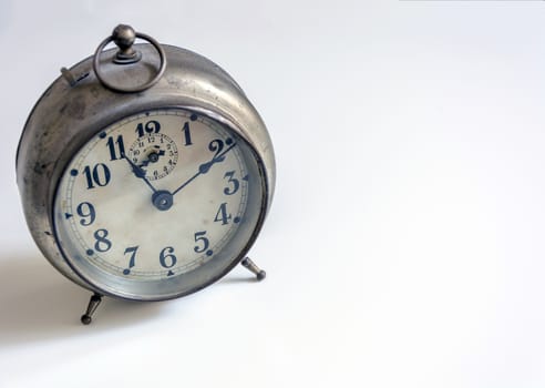 old clock on a white background. Interior shot. Nobody