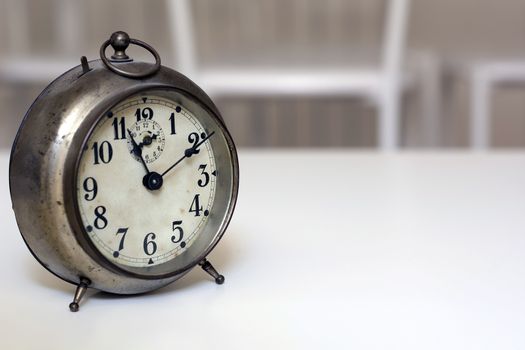 old clock on a white background. Interior shot. Nobody