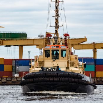 Tug ship in the cargo port of Riga, Europe