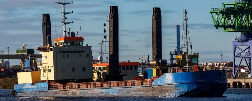 Blue cargo ship in the port of Riga, Europe