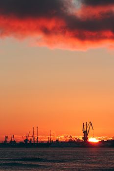 Hot winter sunrise over the cargo port in Riga