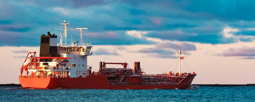 Red cargo oil tanker moving to Baltic sea