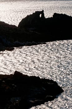 rocky silhouette in sea of patmos island