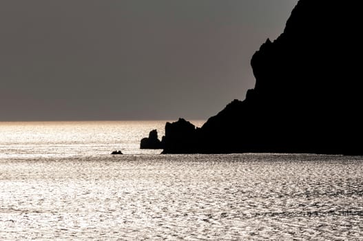 rocky silhouette in sea of patmos island